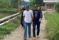 1769360796073-pelaku-saat-diamankan-polisi-karena-cabuli-keponakan-1769343037526_169