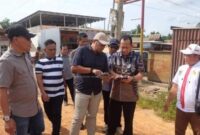 1769490377130-bupati-bbs-tinjau-jalan-buat-perbaikan-infrastruktur-di-simpang-petaling-1769441970340_169